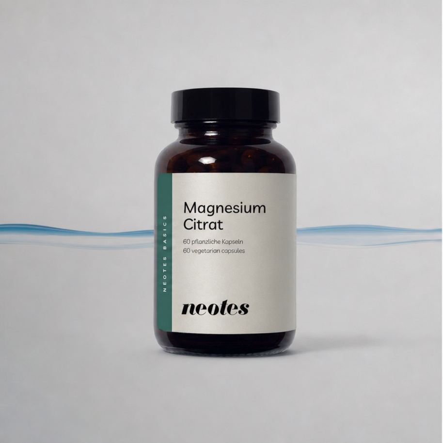 Magnesiumcitrat Kapseln von neotes als Packshot mit Tiegel und grafischer Welle